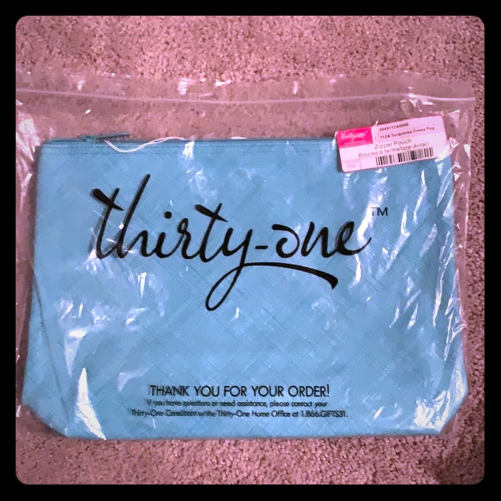 Zipper pouch in turquoise cross pop. NIP